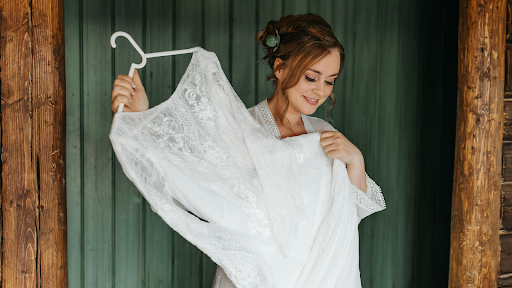 A woman holding her wedding dress